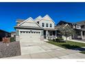 Attractive home with a spacious driveway and professionally landscaped front yard at 2407 Tyrrhenian Cir, Longmont, CO 80504