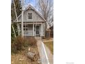 Cozy single-Gathering home with a manicured lawn and inviting front porch at 3056 W 34Th Ave, Denver, CO 80211