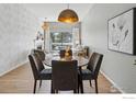 Charming dining area with a round table, stylish chairs, and a view of the cozy living space at 3260 47Th St # 206A, Boulder, CO 80301