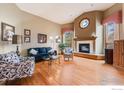 Spacious living room with a cozy fireplace, large windows, and ample natural light at 5665 Cascade Pl, Boulder, CO 80303