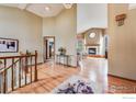Open-concept living area with hardwood floors, fireplace, and seamless flow to other living spaces, creating an inviting atmosphere at 5665 Cascade Pl, Boulder, CO 80303
