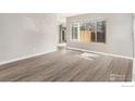 Bright living room with lots of natural light, fresh paint and new flooring at 7974 Chase Cir # 77, Arvada, CO 80003