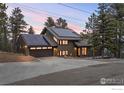 Contemporary two-story home with solar panels, a two-car garage, and modern design at 93 Hawk Ln, Boulder, CO 80304