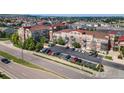 Aerial view of a well-kept condo community with nearby parking and manicured landscaping at 10184 Park Meadows Dr # 1120, Lone Tree, CO 80124