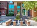 Beautiful entrance with a water feature and modern architecture at 10184 Park Meadows Dr # 1120, Lone Tree, CO 80124
