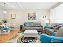 Inviting living room featuring modern furnishings and a vibrant area rug on the beautiful hard wood floors at 11230 Osage Cir # B, Northglenn, CO 80234