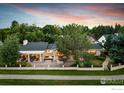 Beautiful home featuring a private backyard retreat and manicured landscaping at 7155 Rustic Trl, Boulder, CO 80301