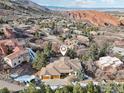 Stunning aerial view of estate with mountain and rock formation scenery at 10113 Thunder Run, Littleton, CO 80125