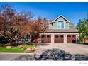 Beautiful two-story home featuring a brick exterior, three-car garage and well-maintained landscaping at 2345 Spotswood Pl, Boulder, CO 80304