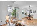 Inviting dining area with light hardwood floors and sliding glass door to the outside at 4248 Corriente Pl, Boulder, CO 80301