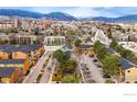 Scenic aerial view of the property, showcasing the surrounding community, mountains and city skyline at 3000 Colorado Ave # 124, Boulder, CO 80303