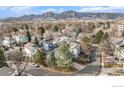 Neighborhood view featuring homes with mature trees, mountain views, and a scenic landscape at 4808 Hopkins Pl, Boulder, CO 80301