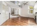 The entryway boasts hardwood floors, a staircase to the second floor, and custom built-ins that offer plenty of storage at 4808 Hopkins Pl, Boulder, CO 80301