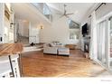 Bright living room with vaulted ceilings, fireplace, and open floor plan at 4808 Hopkins Pl, Boulder, CO 80301