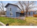 Picture of the backyard showing the exterior of the home with an outdoor patio at 1095 Tantra Park Cir, Boulder, CO 80305