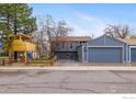 View of the property with the garage and playhouse adjacent to the main structure at 1095 Tantra Park Cir, Boulder, CO 80305