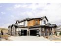 Striking home exterior featuring a spacious three-car garage and modern design elements at 15373 Irving Ct, Broomfield, CO 80023