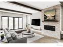 Inviting living room featuring a stone fireplace, wood beams, and large sliding doors at 15373 Irving Ct, Broomfield, CO 80023