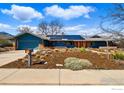 Charming single Gathering home boasts a landscaped front yard, solar panels, and an attached garage at 385 Erie Dr, Boulder, CO 80303