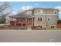 Charming two-story home with a brick facade and covered porch at 3940 Montclair Ln, Boulder, CO 80301