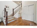 Bright stairway with hardwood flooring and white staircase at 3940 Montclair Ln, Boulder, CO 80301