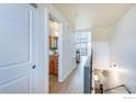 Bright hallway showing a bathroom and an airy living space with modern finishes at 4645 Broadway St # 1, Boulder, CO 80304