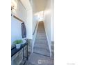 Inviting hallway featuring a staircase with contemporary decor and neutral tones at 4645 Broadway St # 1, Boulder, CO 80304