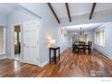 Elegant dining room with hardwood floors and a view into the adjacent living spaces at 6914 Frying Pan Rd, Boulder, CO 80301