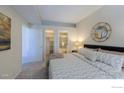 Bright main bedroom with ensuite bathroom and walk-in closet, carpeted for comfort at 7419 Singing Hills Ct, Boulder, CO 80301