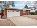 Spacious two-car garage with a wide driveway and convenient access, adding to the home's functionality at 10591 Park Ridge Ave, Longmont, CO 80504