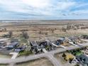 Aerial view of the single-Gathering home situated on a large lot in a tranquil suburban neighborhood at 16620 Umpire St, Hudson, CO 80642
