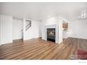 Inviting living room featuring hardwood floors and a fireplace, blending style with comfort at 2254 Spruce St # A, Boulder, CO 80302