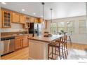 Bright kitchen features a large island, stainless steel appliances and lots of natural light at 247 Rendezvous Dr, Lafayette, CO 80026