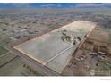 Expansive aerial view showcasing the large acreage and surrounding neighborhood at 28800 E 168Th Ave, Brighton, CO 80603