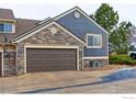 Spacious two-car garage with attractive stone and siding exterior, offering ample parking and curb appeal at 3076 W 112Th Ct # F, Westminster, CO 80031