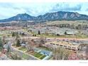 Expansive aerial shot showcasing the property's location with views of the Flatirons in the background at 325 27Th St, Boulder, CO 80305