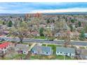 High-angle aerial view of a residential neighborhood with mature trees and a clear blue sky at 325 27Th St, Boulder, CO 80305