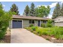 Well-maintained single-story home with a neatly landscaped front yard and attached garage at 3545 Cloverleaf Dr, Boulder, CO 80304