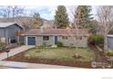 Quaint single-Gathering home featuring a well-kept lawn, mature trees, and a cozy, inviting feel at 3545 Cloverleaf Dr, Boulder, CO 80304