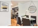 Dining area with a glass table and seating, adjacent to the kitchen at 3790 Iris Ave # B, Boulder, CO 80301