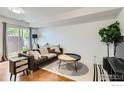 Modern living room features a cozy couch, stylish coffee table, and a bright sliding glass door at 3790 Iris Ave # B, Boulder, CO 80301