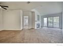 Inviting living room boasts a cozy fireplace and sliding glass doors for natural light at 550 Mohawk Dr # 67, Boulder, CO 80303