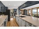 Stylish kitchen with an island, modern appliances, and views of the lake at 7975 Anchor Dr, Longmont, CO 80504