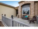 Inviting covered porch with outdoor seating, offering a relaxing space to enjoy the fresh air at 13397 Franklin St, Thornton, CO 80241