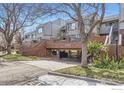 Multi-level condos showcasing brickwork and covered parking space at 3260 47Th St # 108A, Boulder, CO 80301