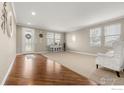 Open-concept living area with ample natural light and stylish furnishings at 4221 Pioneer Pl, Brighton, CO 80601