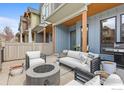 Inviting outdoor patio with comfortable seating, a fire pit, and a built-in grill at 5318 5Th St # E, Boulder, CO 80304