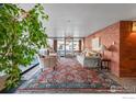 Inviting lobby with a decorative rug, comfortable seating, and a view to the outside at 624 Pearl St, Boulder, CO 80302