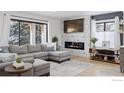 Cozy living room features a modern fireplace, large windows, and comfortable seating at 6969 Harvest Rd, Boulder, CO 80301