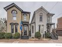 Side-by-side view of two charming painted brick homes, showing architectural details and landscaping at 718 25Th St, Denver, CO 80205